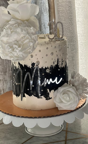 a cake with a cake topperf and flowers