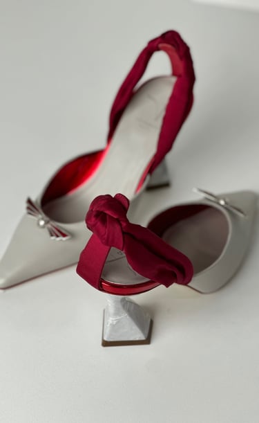 Judy Mazzotti pair of shoes with a bow tie on the side