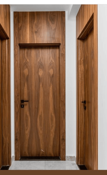 a wooden door with a wooden door and a door handle