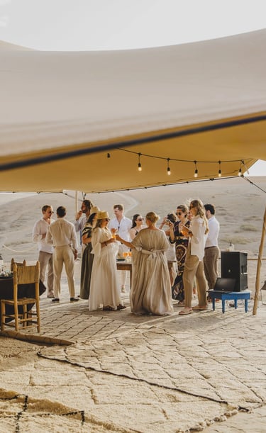 a group of people standing around a table