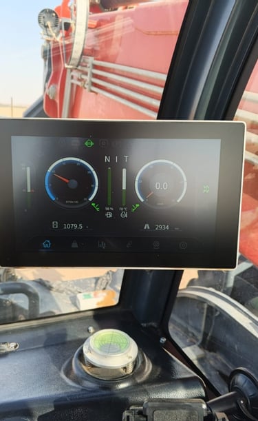 Digital dashboard display inside a forklift pwas camra cabin showing RPM, speed, and engine data.