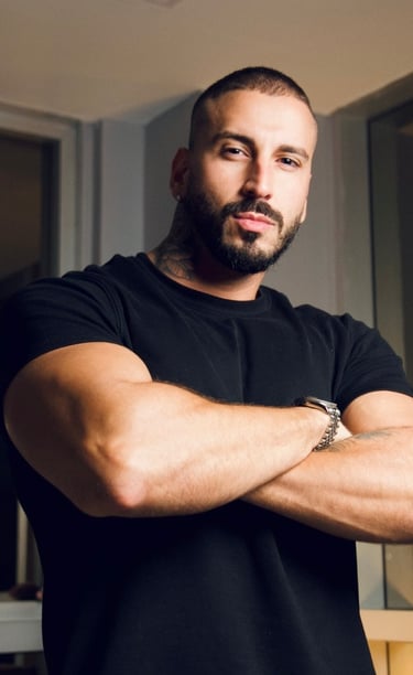 a man with a beard and a beard, standing in front of a mirror