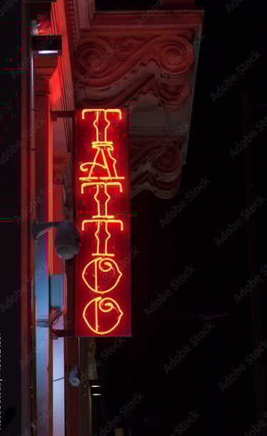 Image showing a neon sign with Tattoo