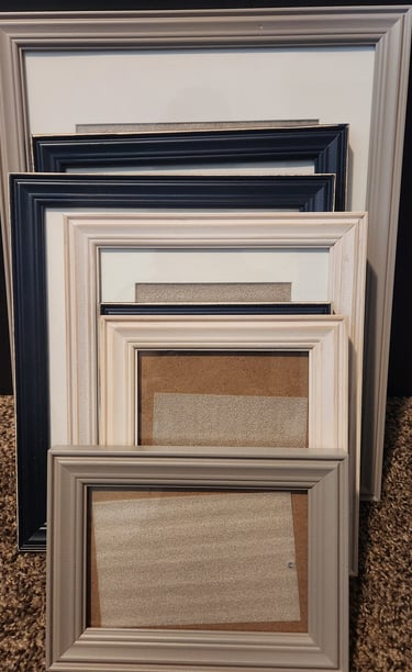 Empty picture frames stacked together
