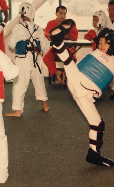 attempting to kick my opponent's face as he casually watches from afar