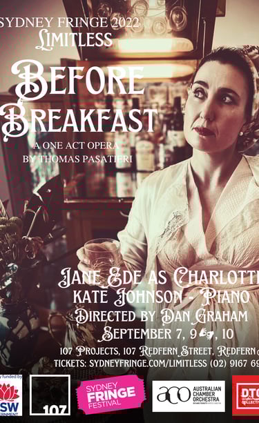 A woman is sitting down with a glass on her hand. She wears a vintage inspired dress from the 1940s.