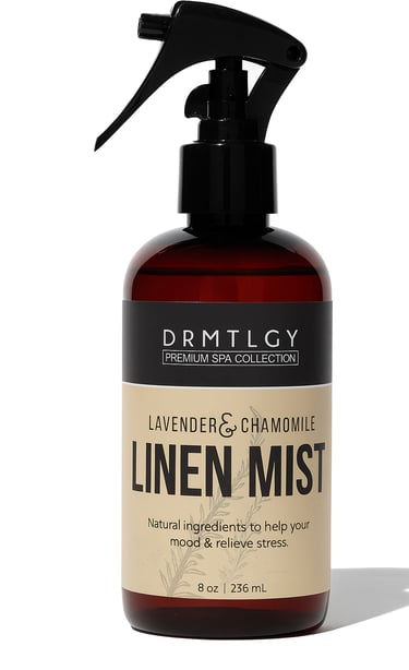 Amber linen spray bottle with black nozzle on white