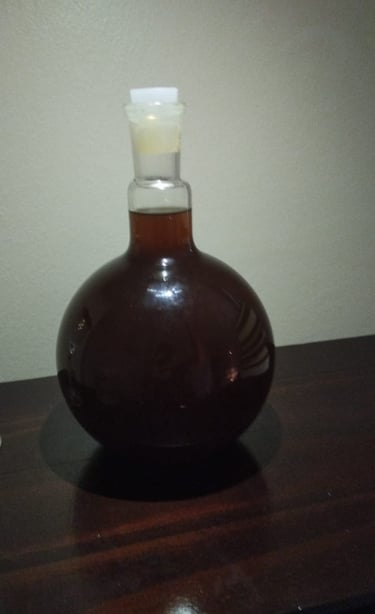 a bottle of liquid in a glass bottle
