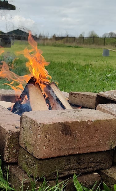 a fire pit with a fire in the middle of it