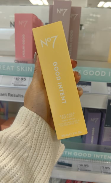 White text on the yellow packaging of Radiance Reflect Serum Spray packaging for Boots No7 Good Intent skincare range
