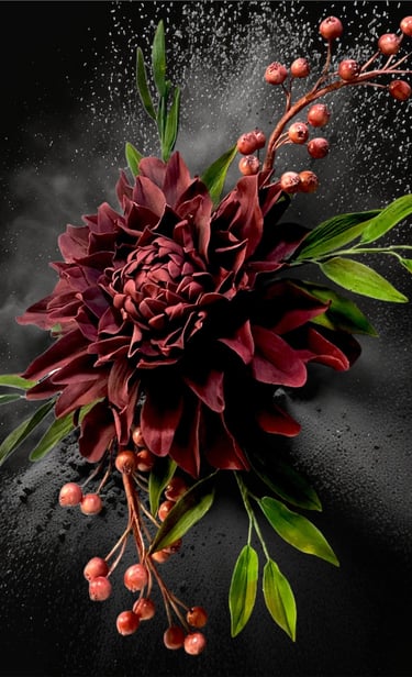 a sugar dahlia flower with red berries and green leaves