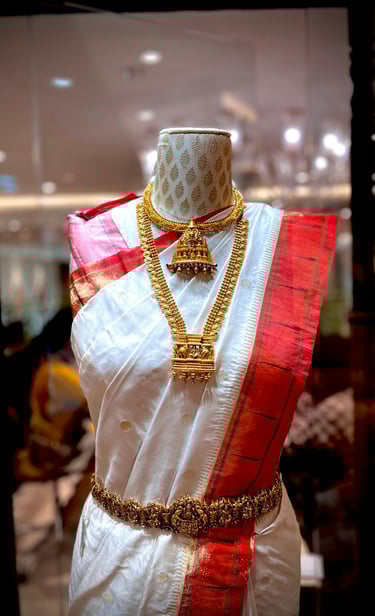 A mannequine of a woman's dress and a necklace.