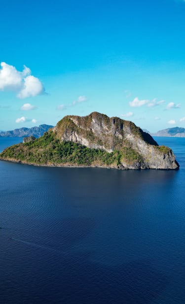a small island with a small island in the middle of the ocean