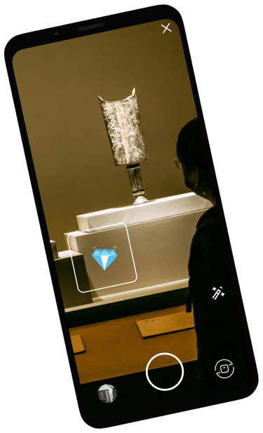 a person standing in front of a art exposition with a diamant sticker 