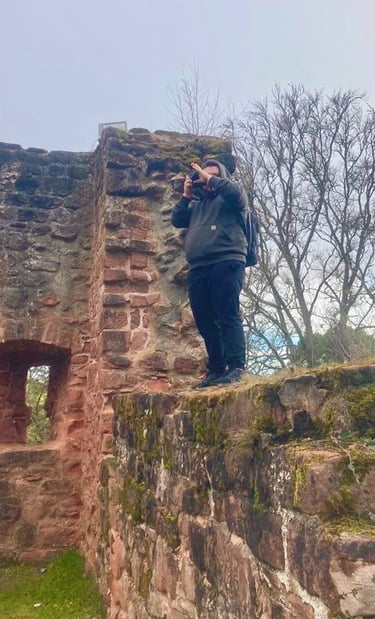 a man taking a picture of a woman taking a picture of herself