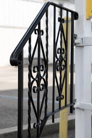 a black and white railing railing with a yellow sign