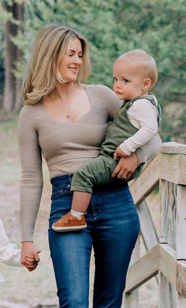 an adoption consultant woman holding a baby in her arms