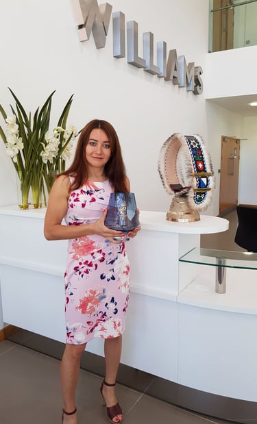 Selin holding the Queens Award at WAE reception