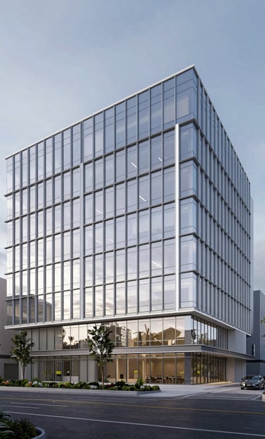 A professional 3D rendering of a proposed campus building with a glass facade, reflecting a soft white and steel blue sky in a North American / US urban setting. The design is aspiring and forward-looking.