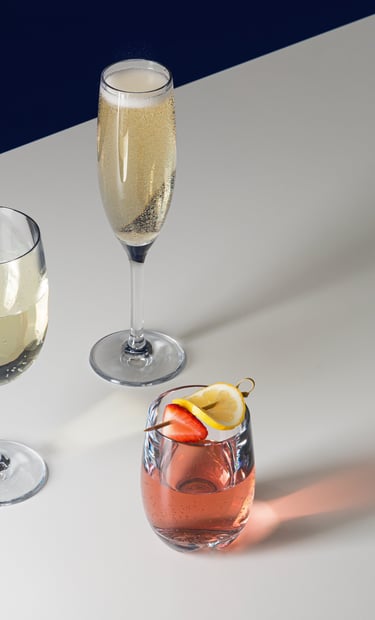 Product photography - two glasses of wine and a cocktail in a glass on a table