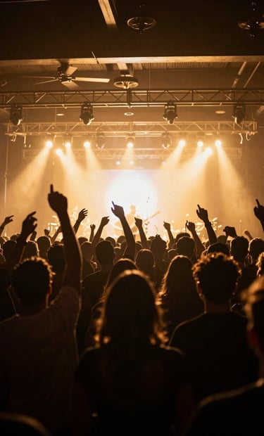 A high-contrast photography of an energetic crowd at an upscale North American local music venue, silhouettes seen against a brilliant golden stage light, capturing a premium and exclusive night atmosphere.