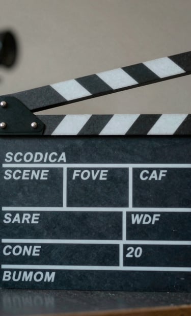 A close-up of a professional film slate in a North American studio, soft ambient charcoal and slate blue lighting, contemporary and professional atmosphere.