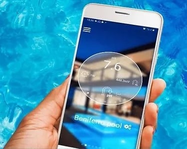 a person holding a smart phone in their hand