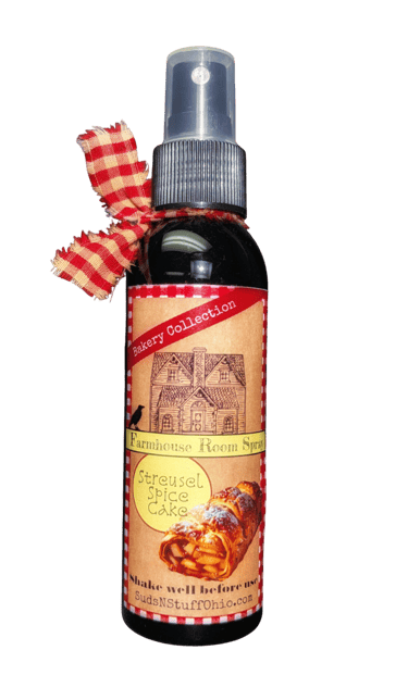 a bottle of "spice cake" room spray with a red rustic ribbon tied to it