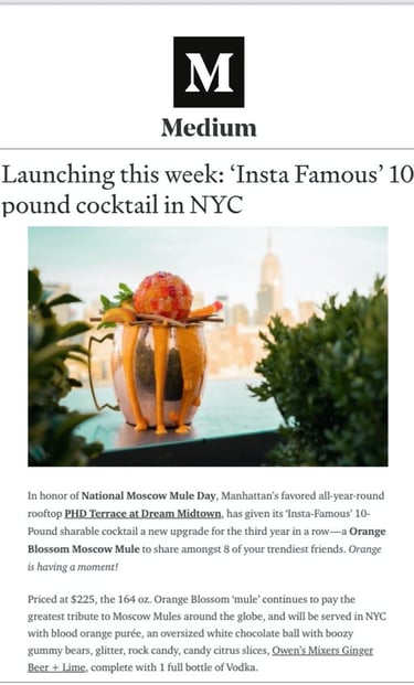 a cocktail in a glass vase with a cocktail glass