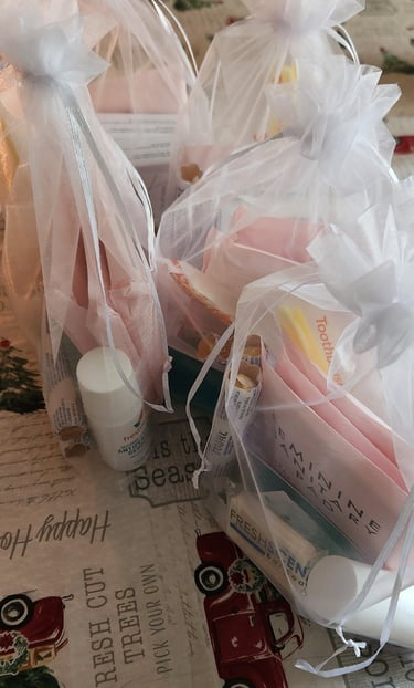 a table with a bunch of hygiene kits laid out