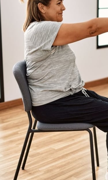 Chair yoga with arms and legs straight out to train core