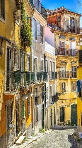 Lisbon - Downtown neighborhood with rows of buildings & cobblestone streets