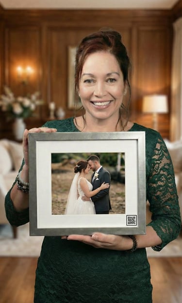 a woman holding a picture of a wedding shot with a QR code from keepsakesqr