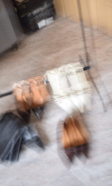 a bunch of vintage shoes and vintage and archive products on the ground