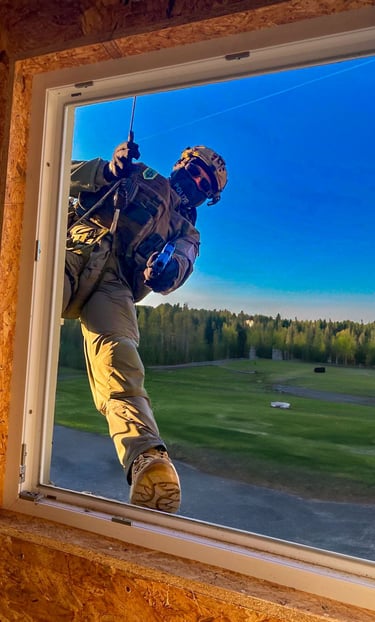 a german piloce officer entring a window with a training gun using the rapid rappel system