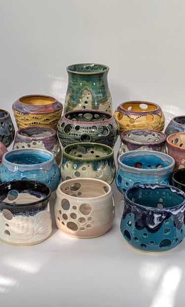 A collection of GonPotty ceramic tealights