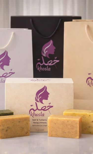 Khosla natural hair care products including sidr and turmeric soaps, shampoo, and conditioner with branded packaging.