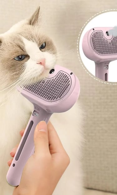 A pink electric steamy cat brush being used on a long-haired Ragdoll cat for grooming and deshedding.
