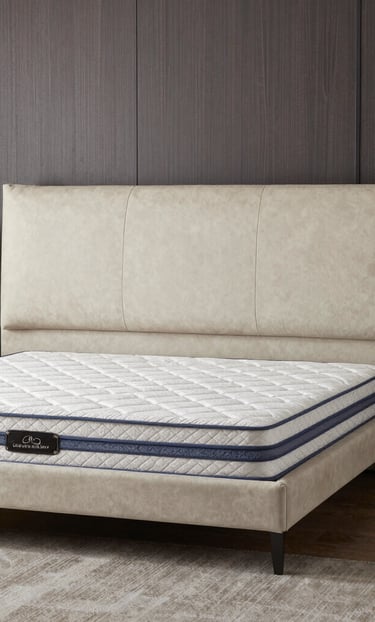 Professional technician carefully cleaning a beige armchair with specialized equipment at home