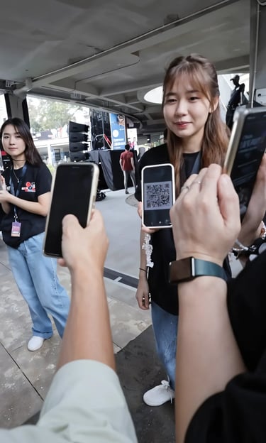 Visitor scanning QR code for event gamification digital passport registration in Jakarta