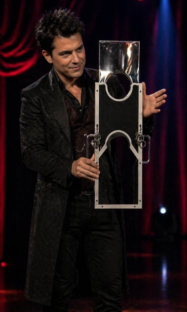Professional magician on stage performing a classic guillotine magic trick with impenetra 
