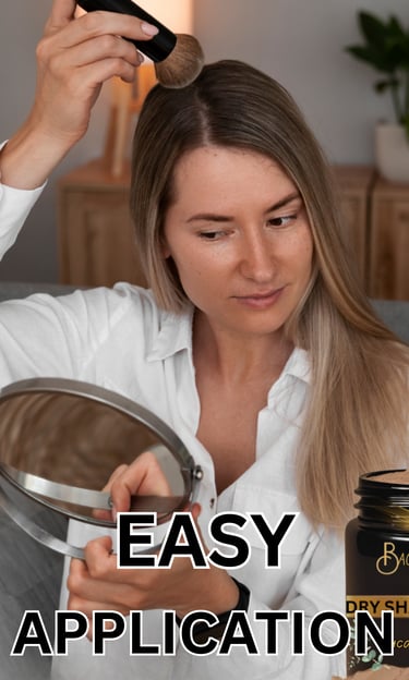 A LADY APPLYING DRY SHAMPOO POWDER TO HER HAIR 