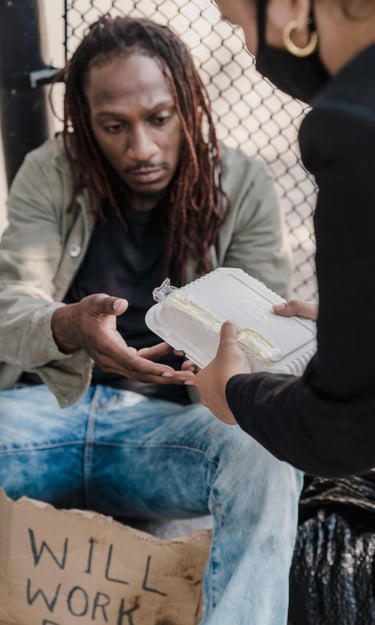 woman handing man a container of food