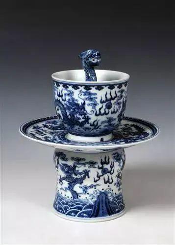 A ceramic cup featuring a dragon design