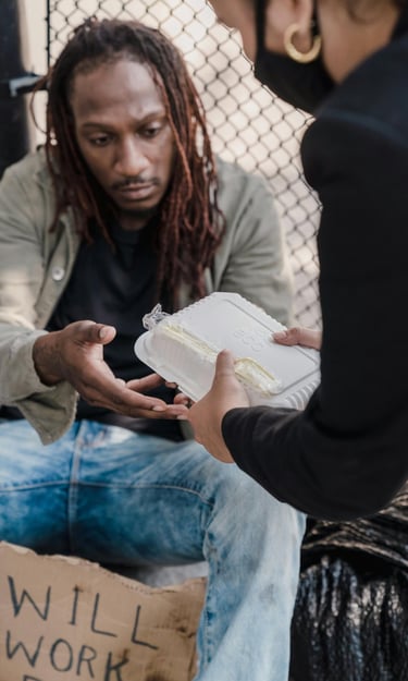 woman handing man a container of food