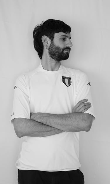 man standing looking to the left with crossed arms