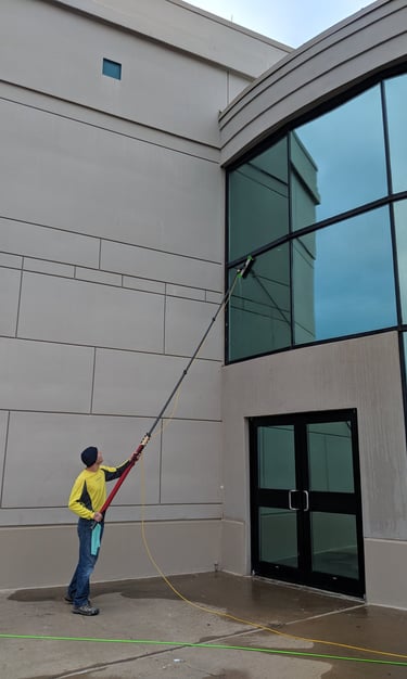 Cleaning windows of a commercial business with a five stage filtration water pool 