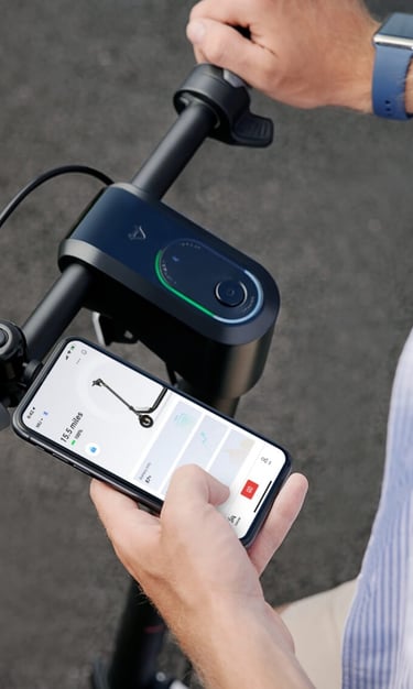 a man holding a cell phone in his hand