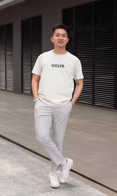 a man in a white shirt and grey pants