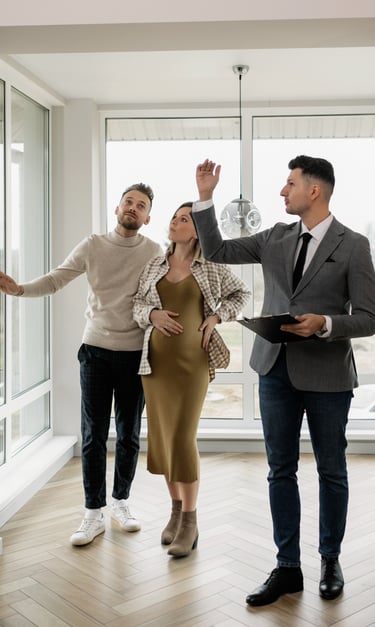 Real estate agent showing a home to potential buyers